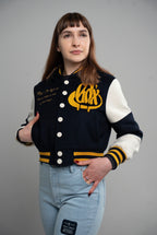 GRADOX Varsity Jacket With Hood from the Hope Collection, women's fit, shown on a model in a studio setting.